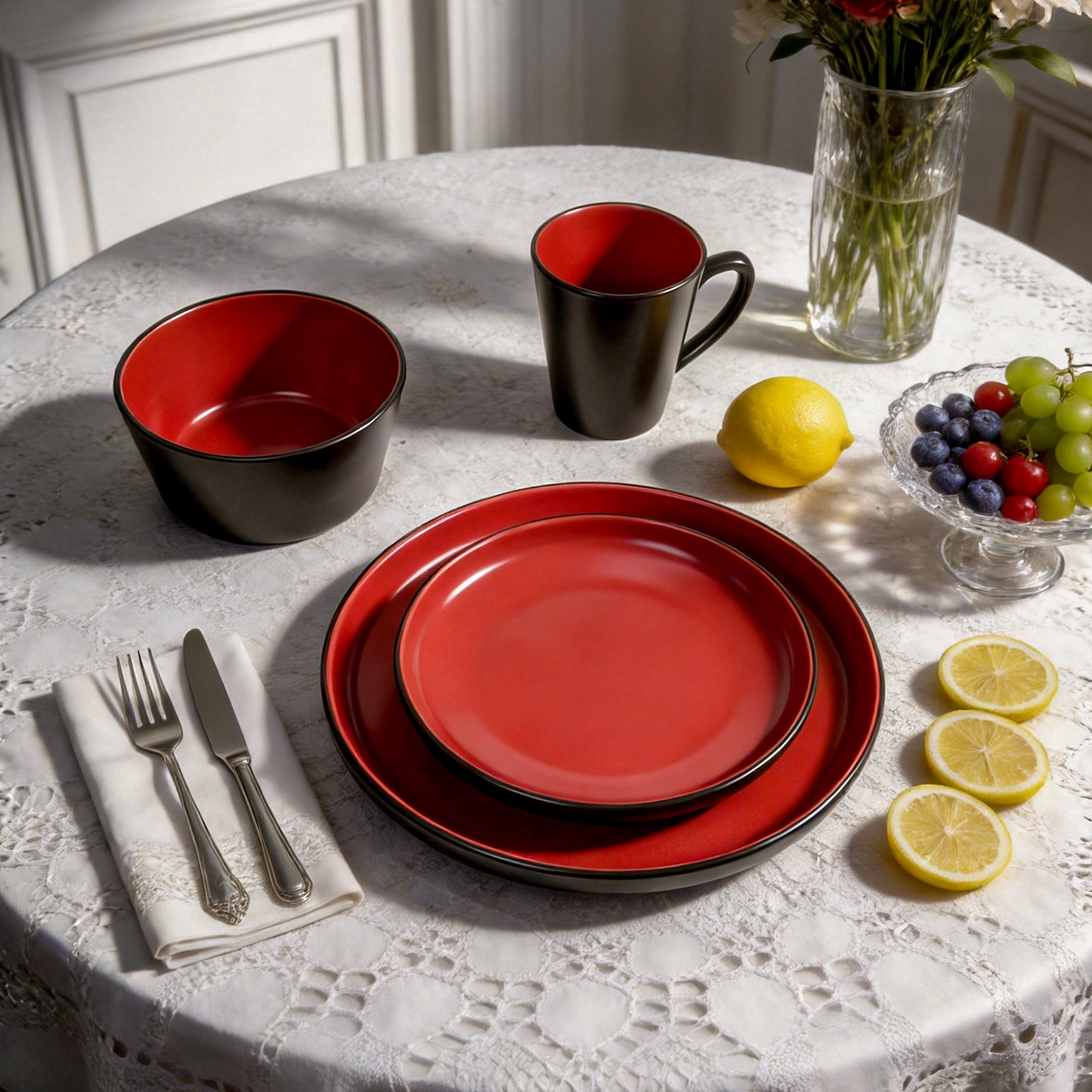 Close-up detail of HomeVSS red and black ceramic dinner plate with ergonomic high sides to prevent sauce from spilling.