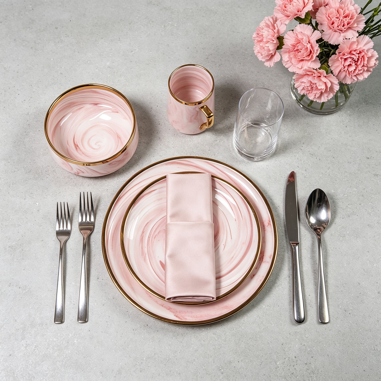 Aerial view of a HomeVSS pink plates and bowls place setting on a dining table