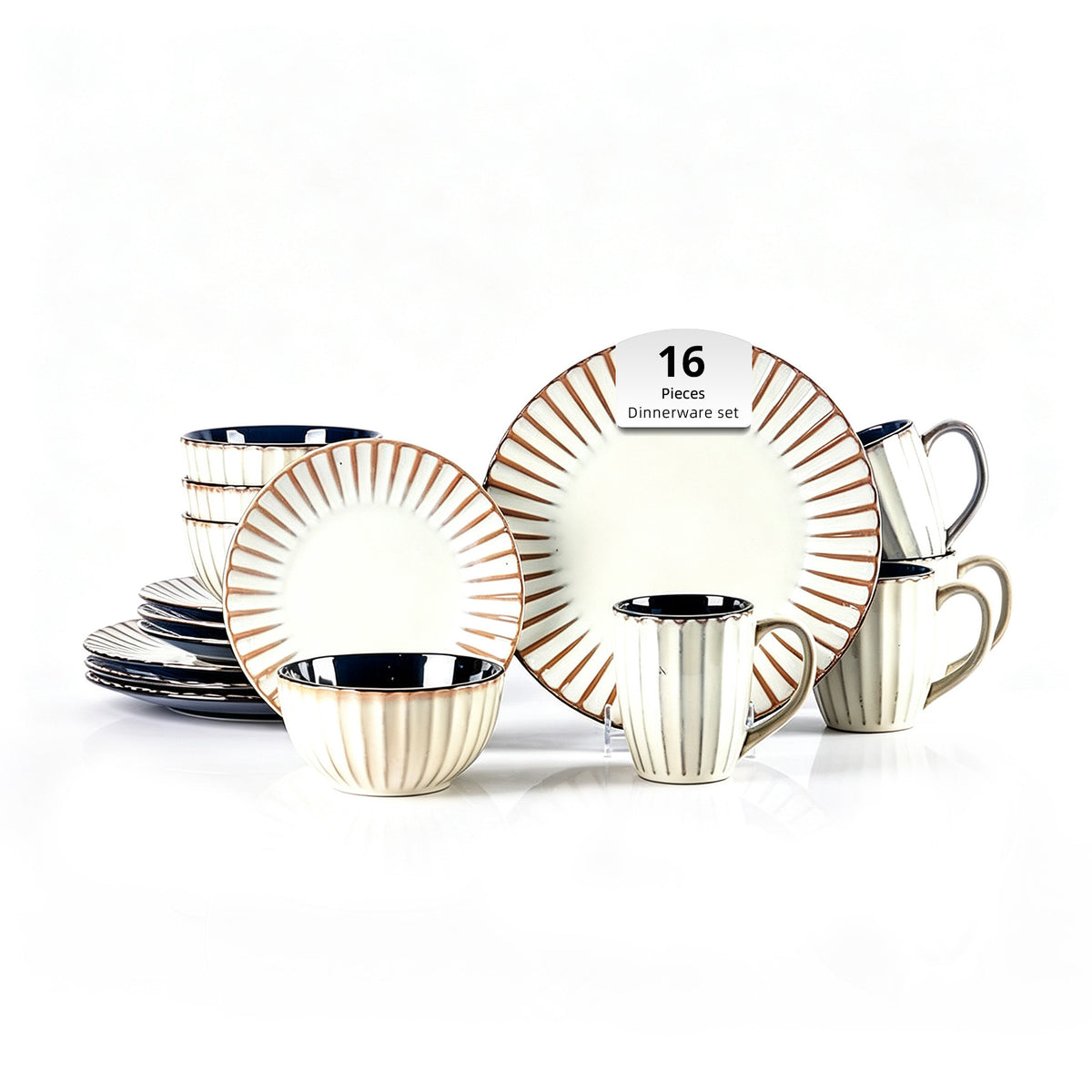 A 16-piece ceramic dinnnerware set on a white background, featuring plates, bowls, and mugs with a cream-colored body, fluted vertical ridges, and a metallic gold sunburst pattern around the rims, with dark blue interiors.