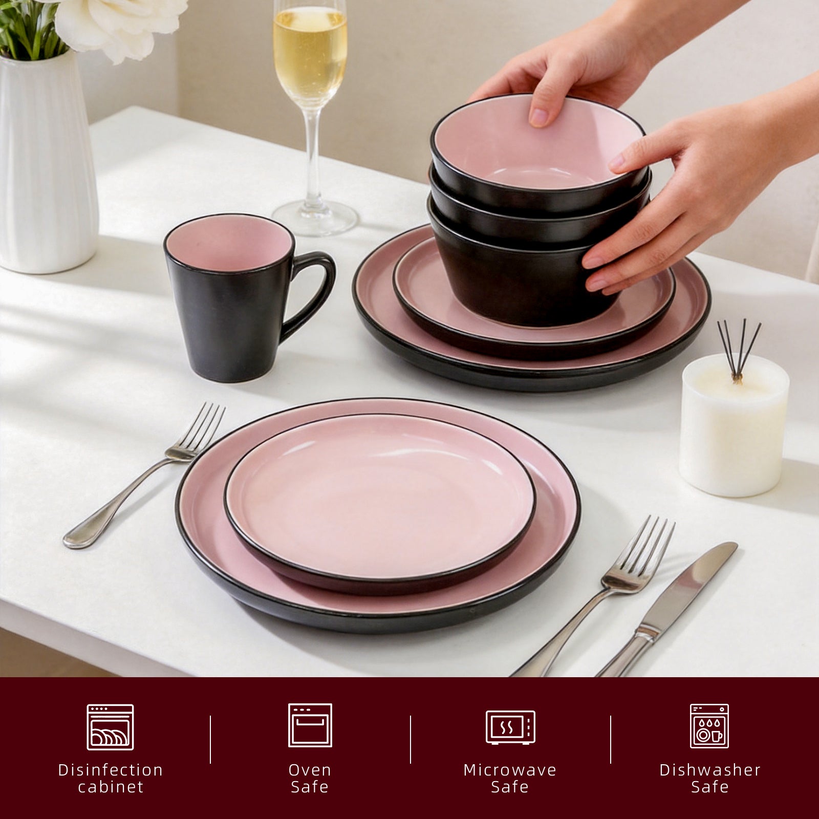 Ceramic dinnerware set in pink and black on a table with a hand picking up a bowl.