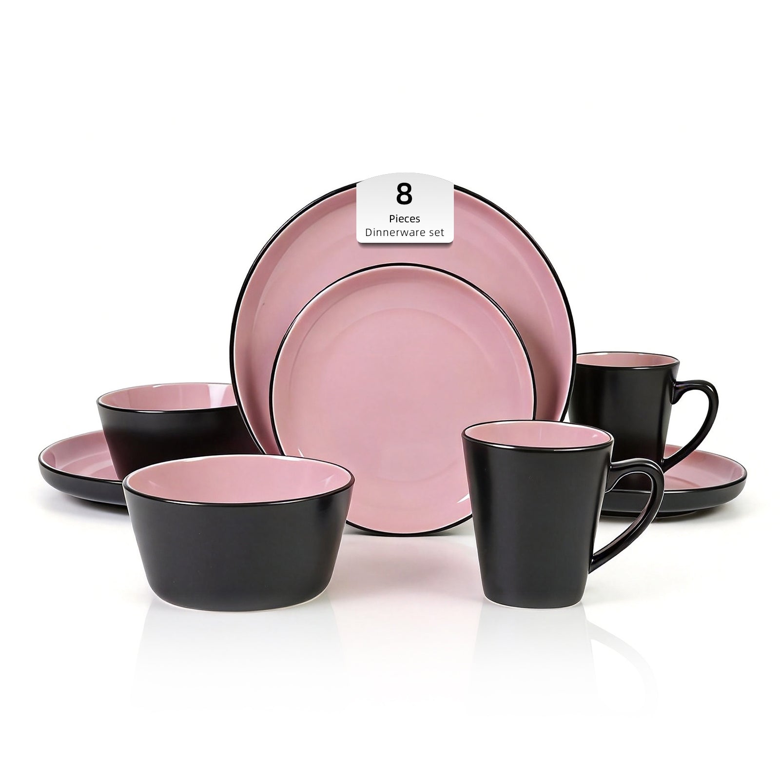 Dinnerware set with pink and black dishes on a white background