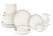 Set of ceramic dinnerware including plates, bowls, and mugs on a white background
